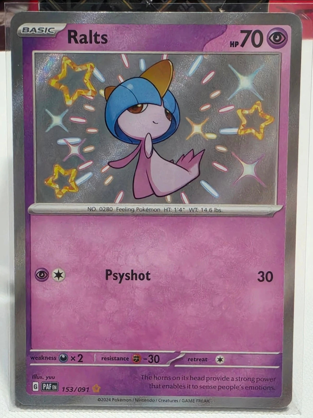 Ralts 153/091 SV: Paldean Fates Holo