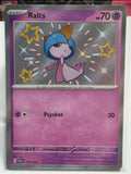Ralts 153/091 SV: Paldean Fates Holo